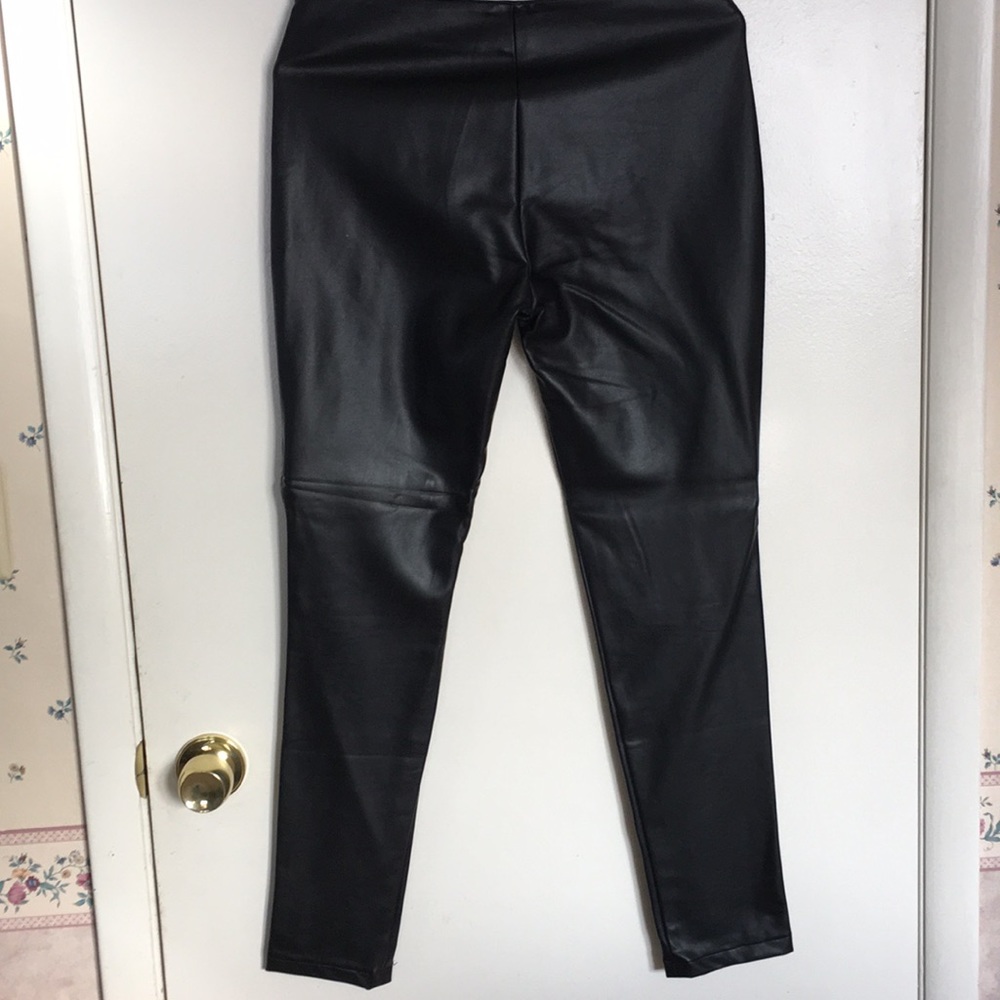 Woman’s faux black leather slacks.